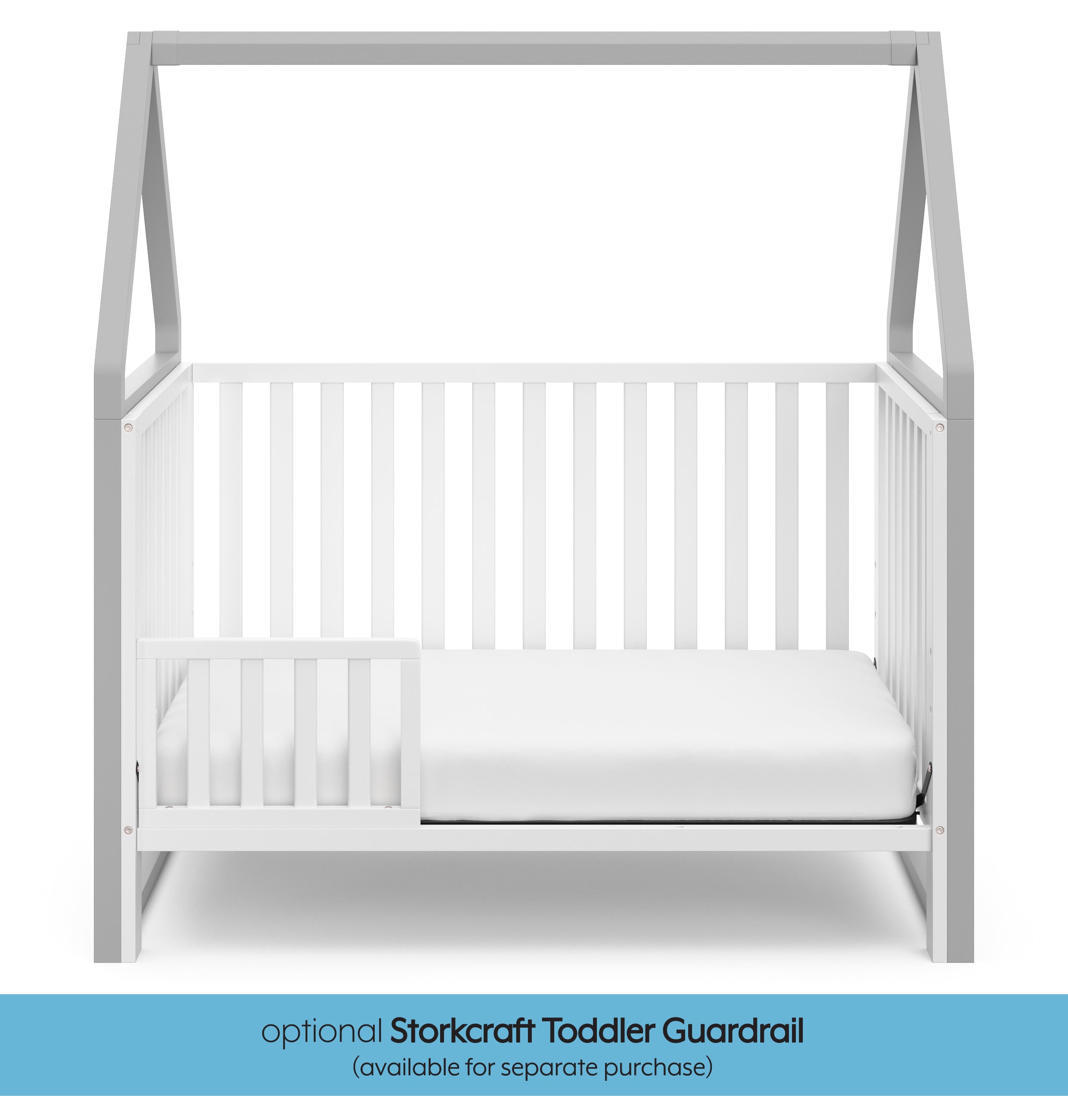 White crib with pebble gray in toddler bed conversion with one safety guardrail graphic