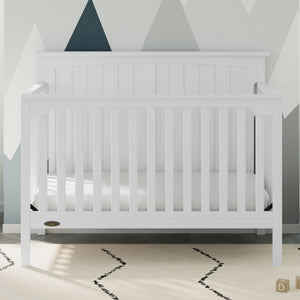 White crib in nursery