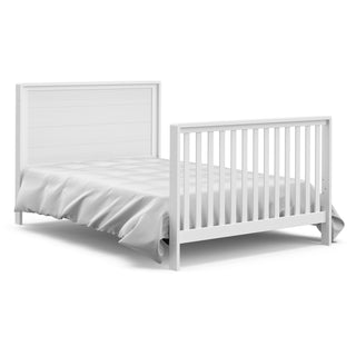 White crib with drawer in full-size bed with headboard and footboard conversion