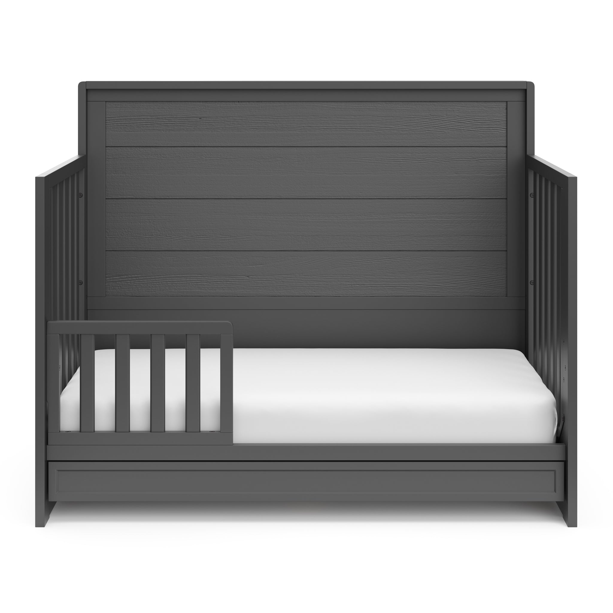 gray crib with drawer in toddler bed conversion with one safety guardrail