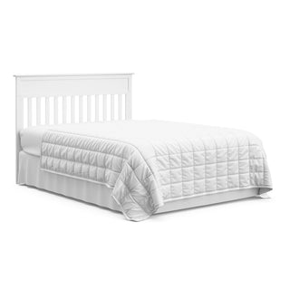 White crib and changer with drawer in full-size bed with headboard conversion