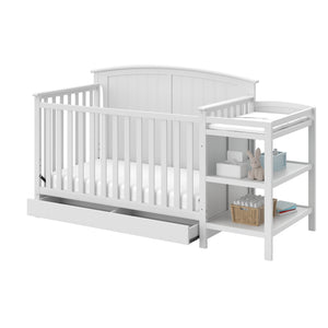 White crib and changer angled with open drawer 