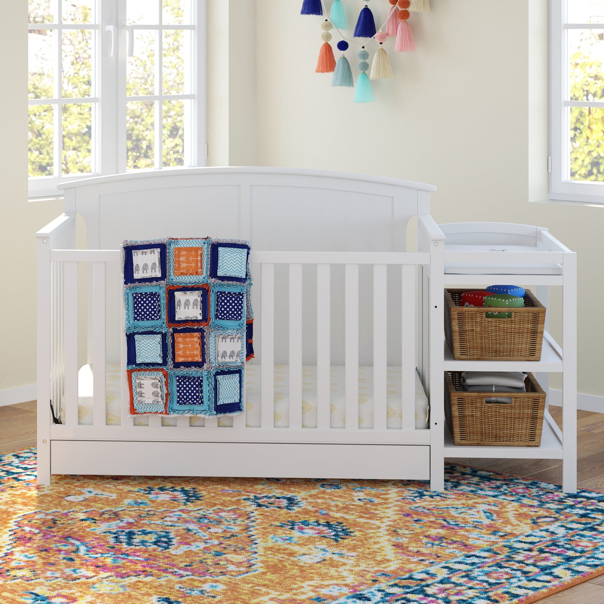 White crib and changer in nursery 