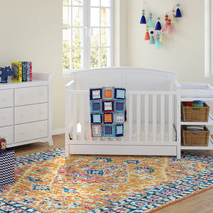 White crib and changer in nursery with 6 drawer dresser