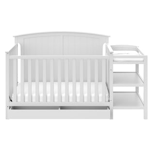 Front view of White crib and changer 