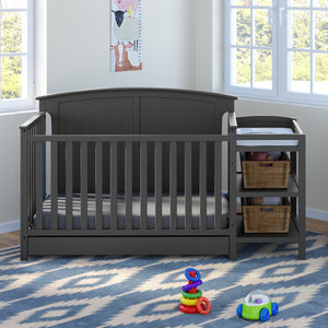 gray crib and changer in nursery 