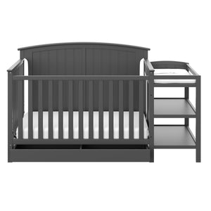Front view of gray crib and changer 