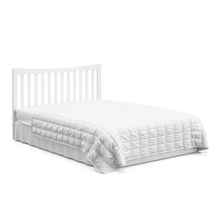 White crib and changer with drawer in full-size bed with headboard conversion