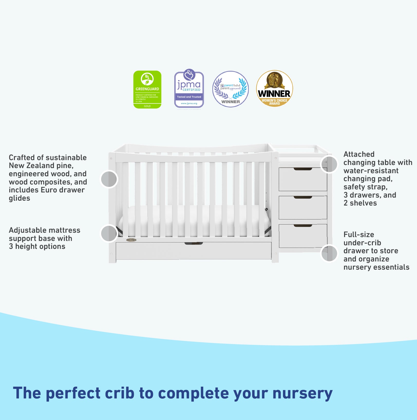 White crib and changer features graphic