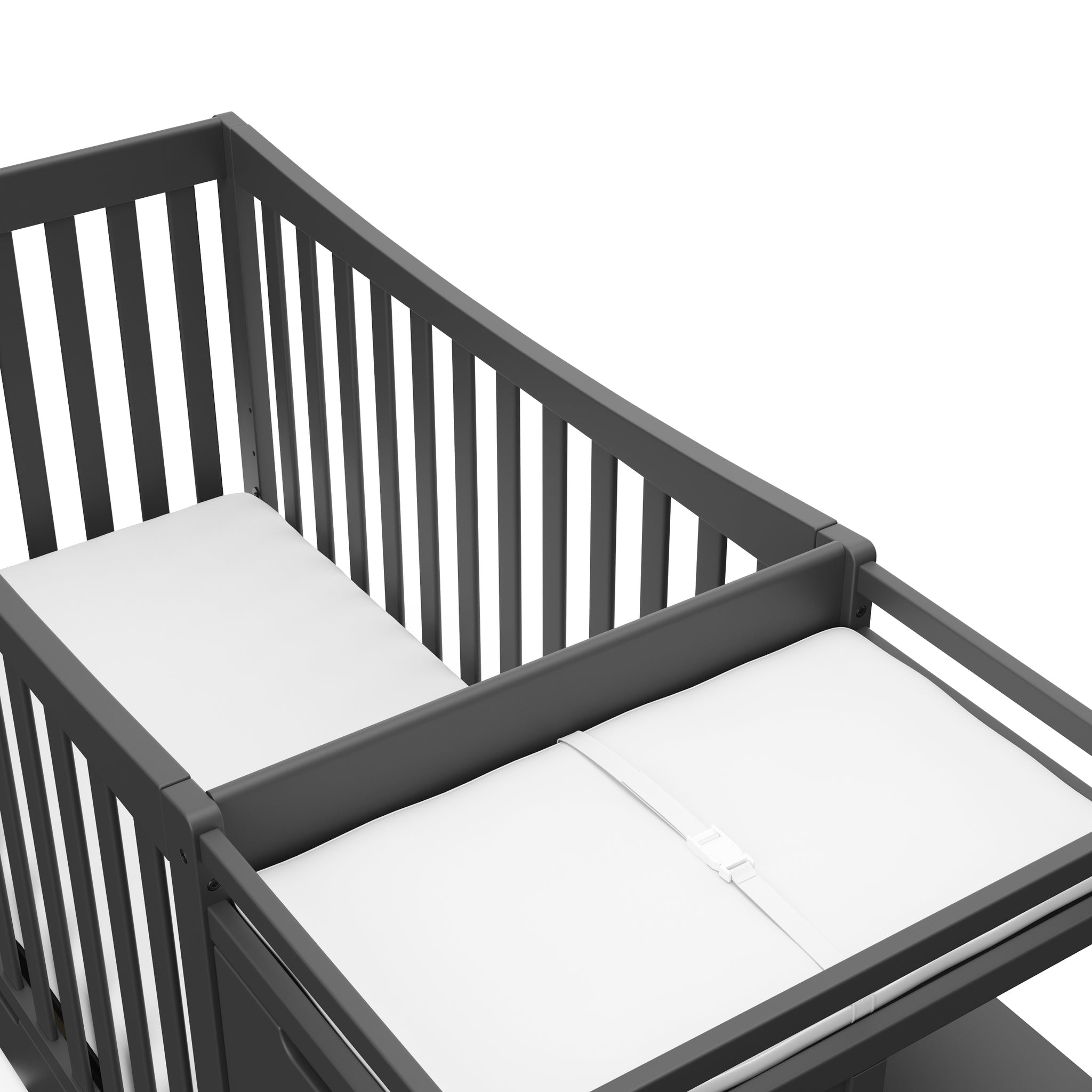 Close-up view of gray crib and changer 
