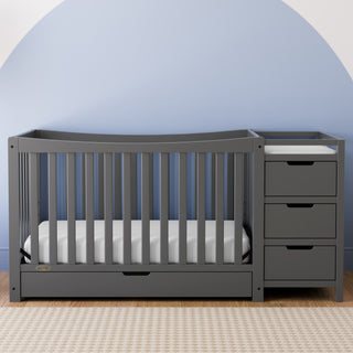 gray crib and changer with drawer in nursery