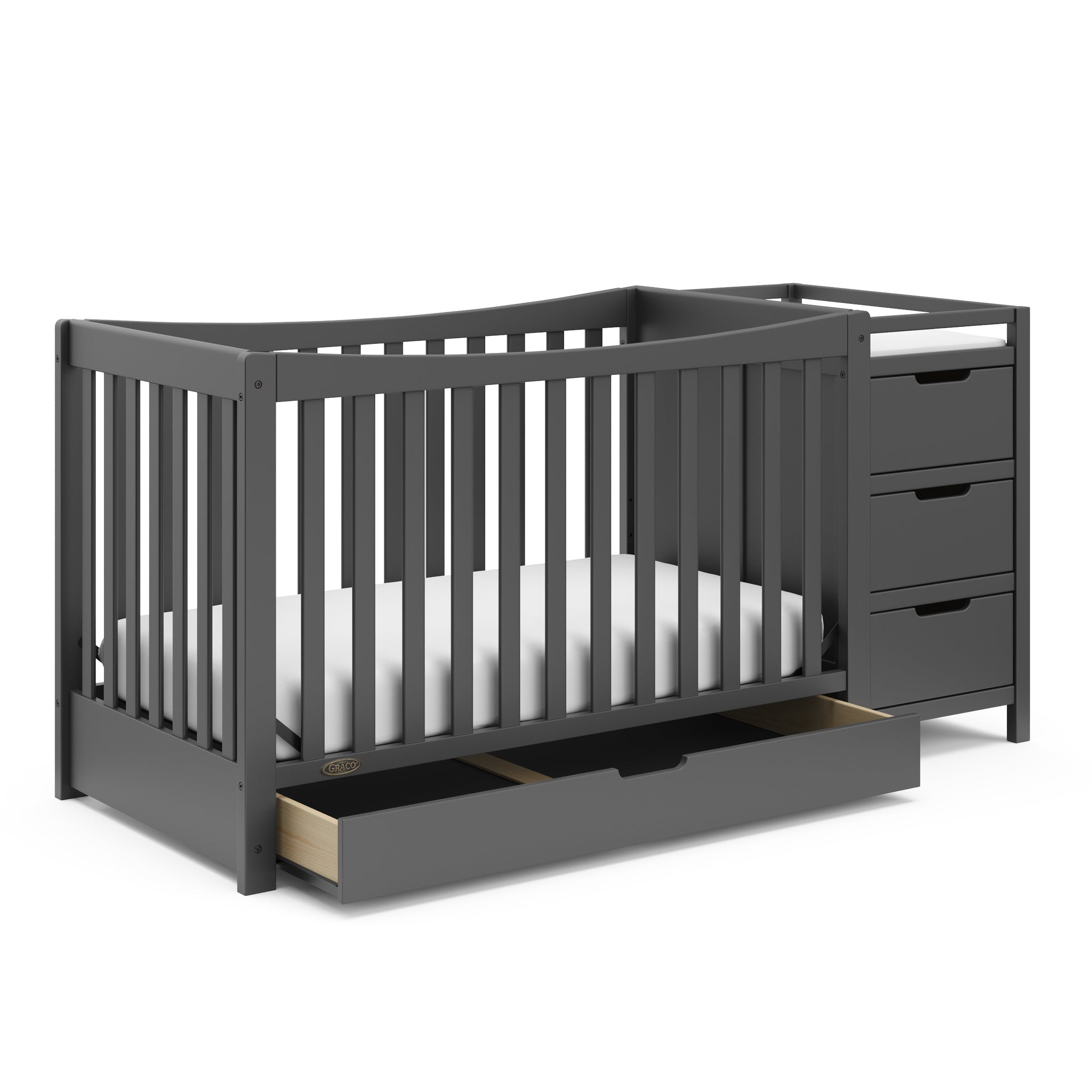 gray crib and changer angled with open drawer