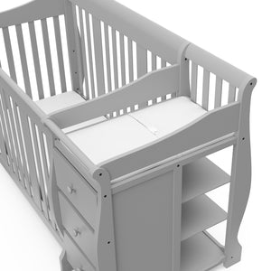 Close-up view of Pebble gray crib and changer 