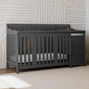 gray crib and changer in nursery 