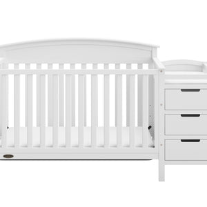 Front view of white crib and changer