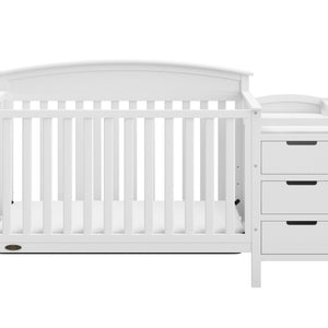 Front view of white crib and changer