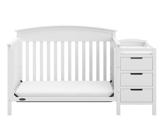 White crib and changer in toddler bed conversion