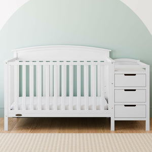 White crib and changer in nursery