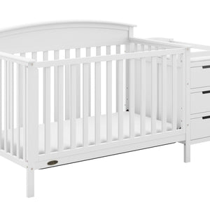 White crib and changer angled