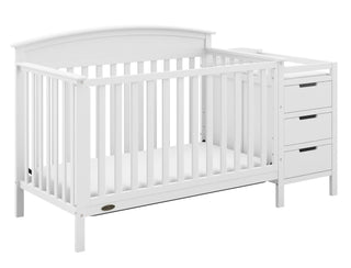 White crib and changer angled