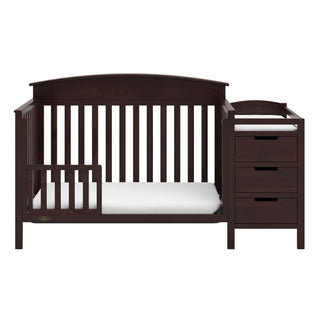 espresso crib in toddler bed conversion with one safety guardrail