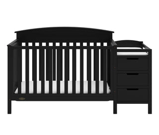 Close-up view of black crib and changer