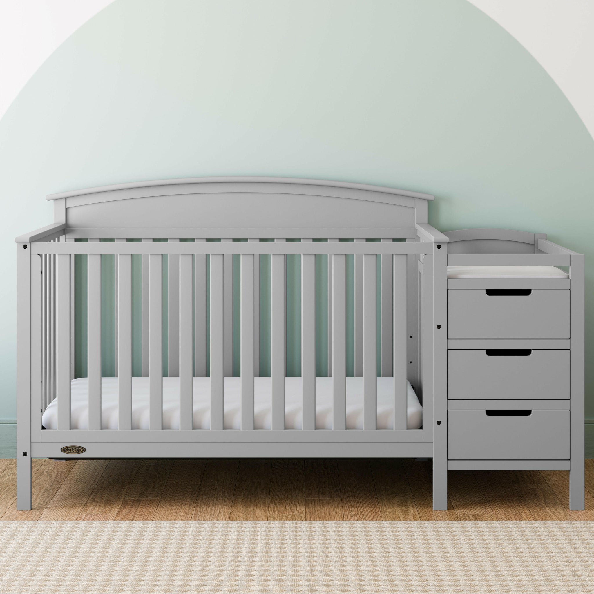 Pebble gray crib and changer in nursery