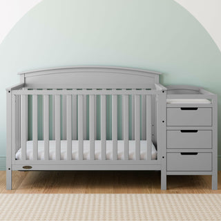 Pebble gray crib and changer in nursery