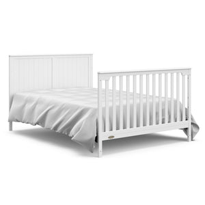 White crib and changer with drawer in full-size bed with headboard and footboard conversion