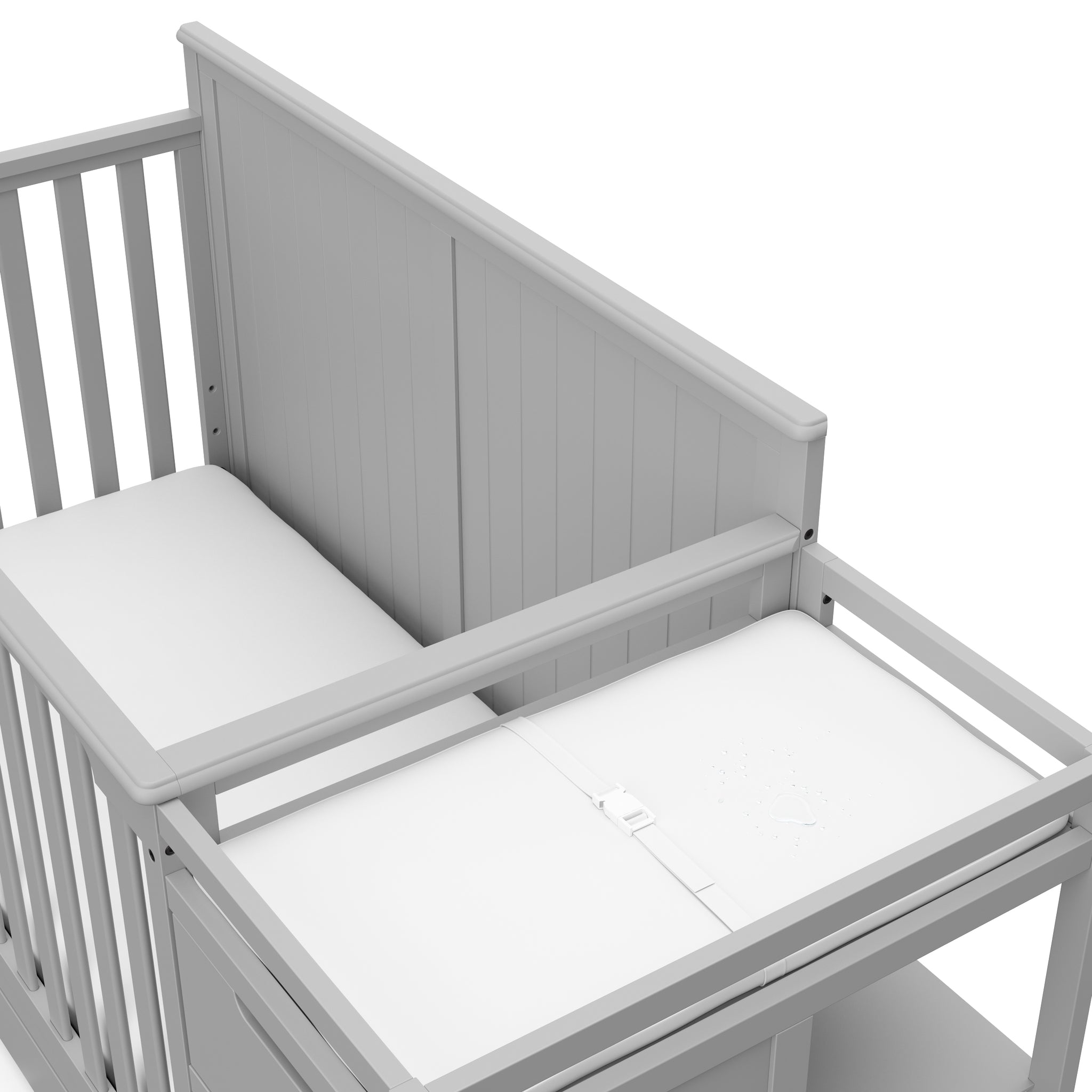 Close-up view of Pebble gray crib and changer with drawer