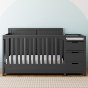 gray crib and changer with drawer in nursery