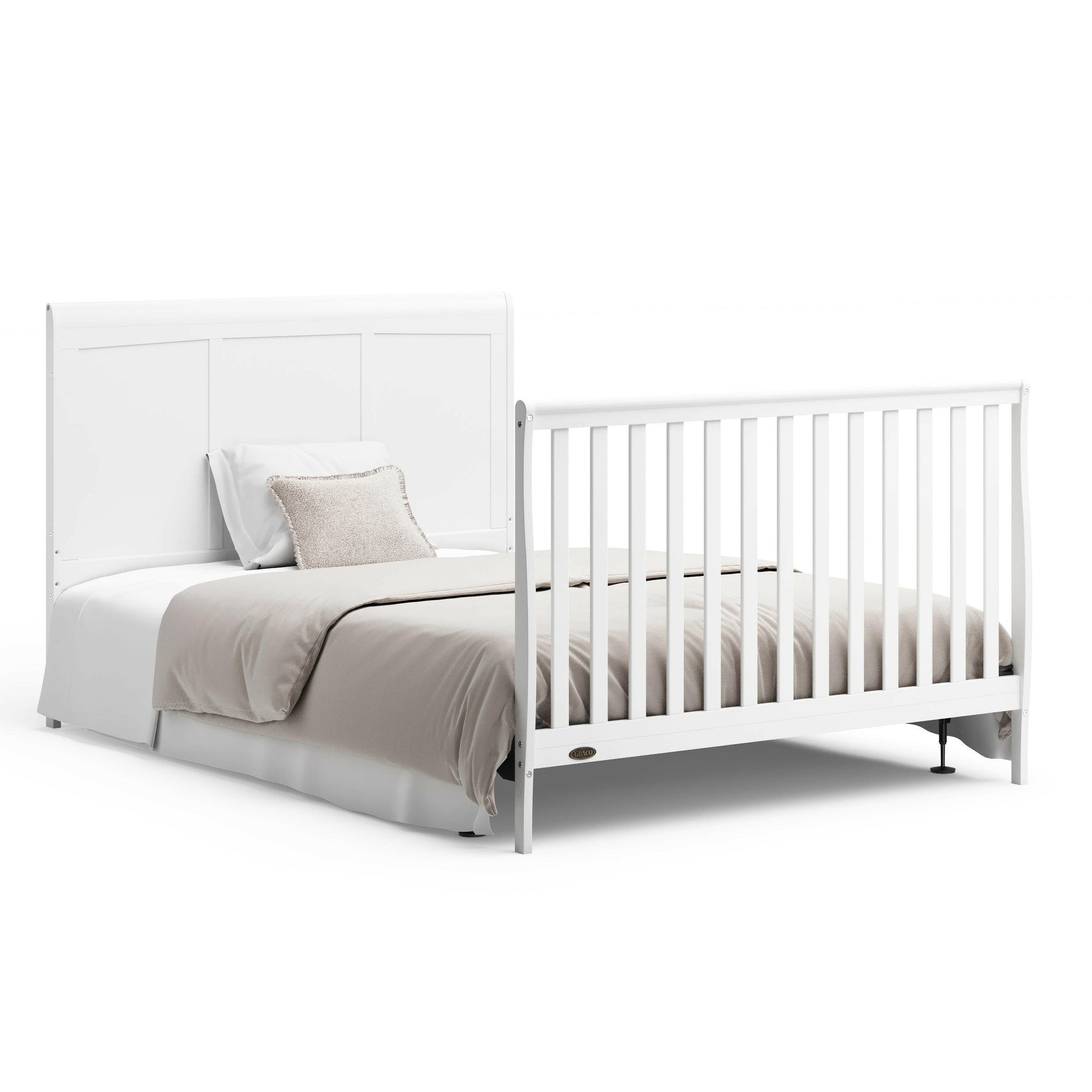 White crib in full-size bed conversion with headboard and footboard