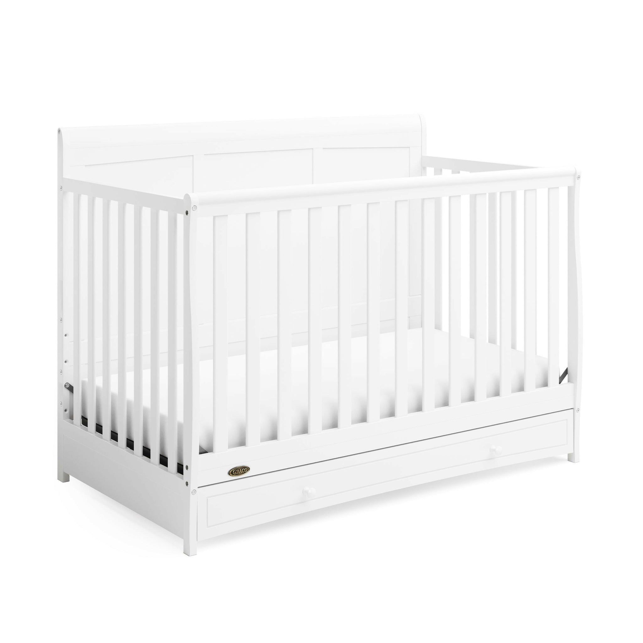 White crib with drawer angled