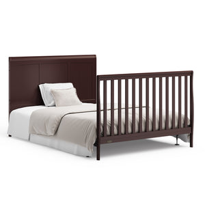 Espresso crib with drawer in full-size bed conversion with headboard and footboard