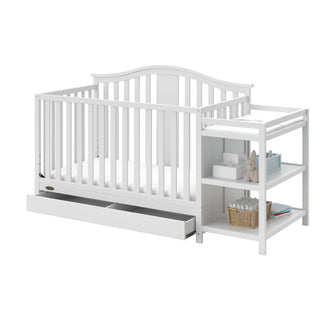 White crib and changer angled