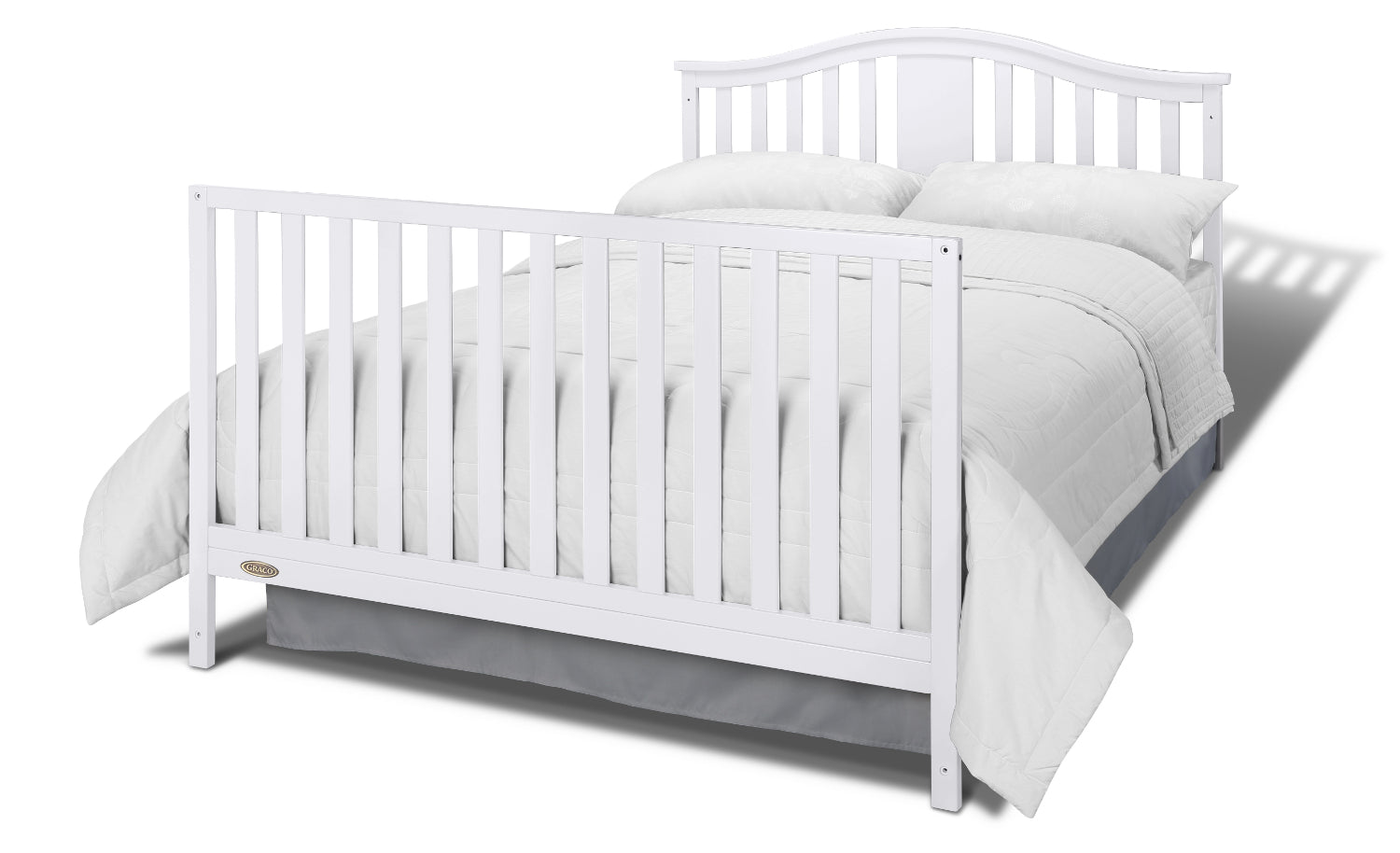 White crib in full-size bed with headboard and footboard conversion