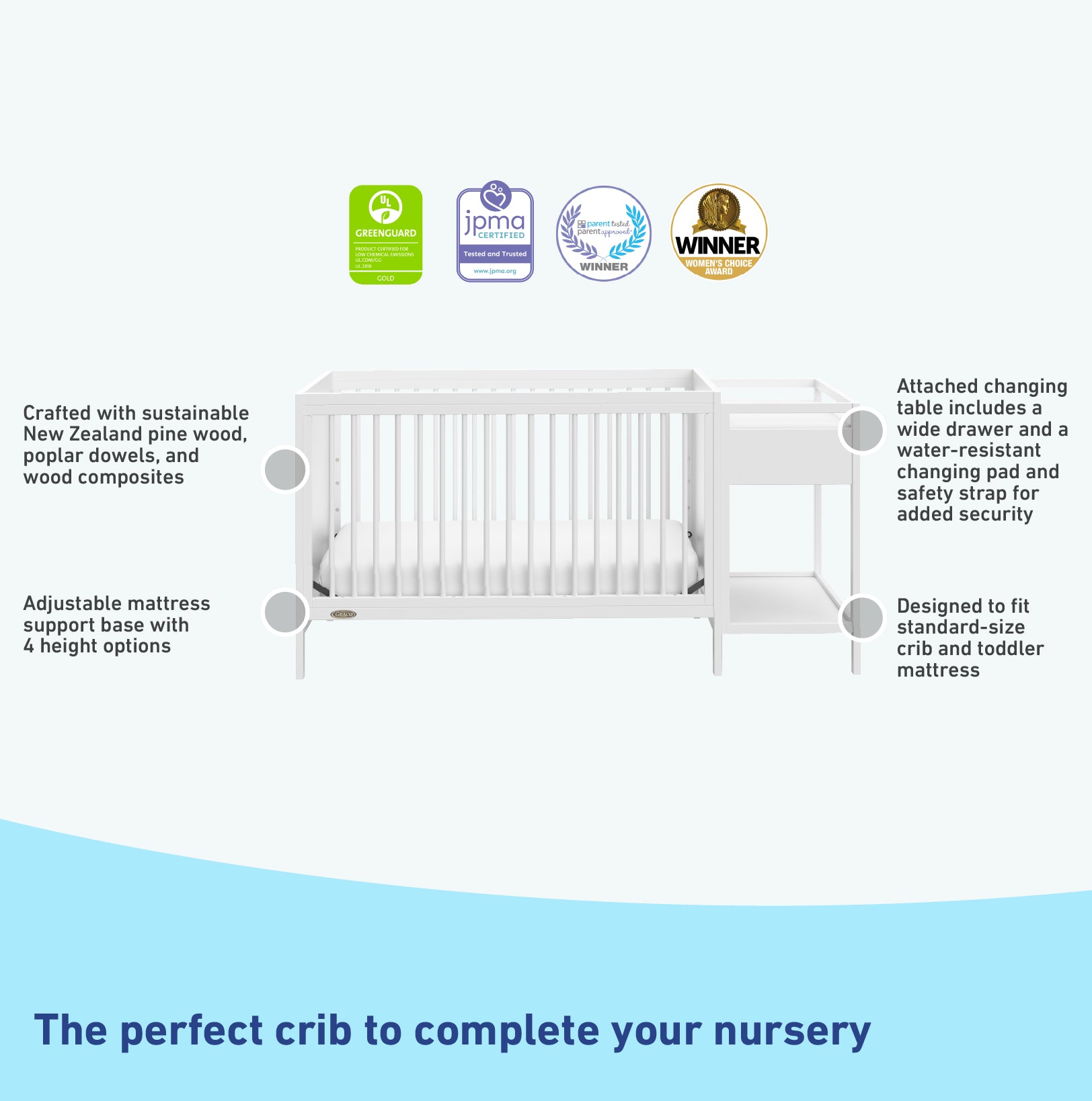 White crib and changer features graphic