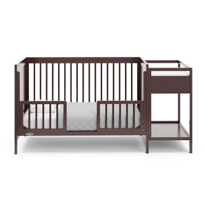 espresso crib in toddler bed conversion with two safety guardrails