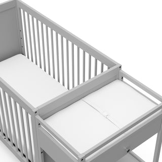 Close-up view of Pebble gray crib and changer
