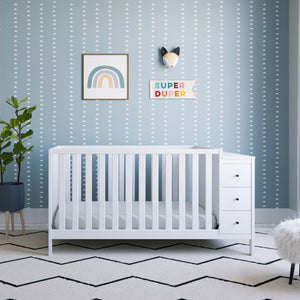 white crib and changer in nursery