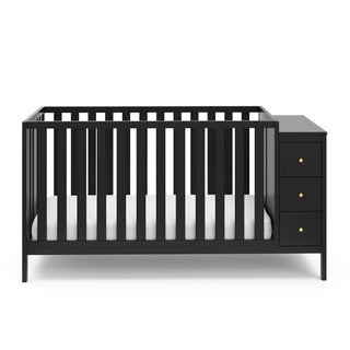 Front view of black crib with storage