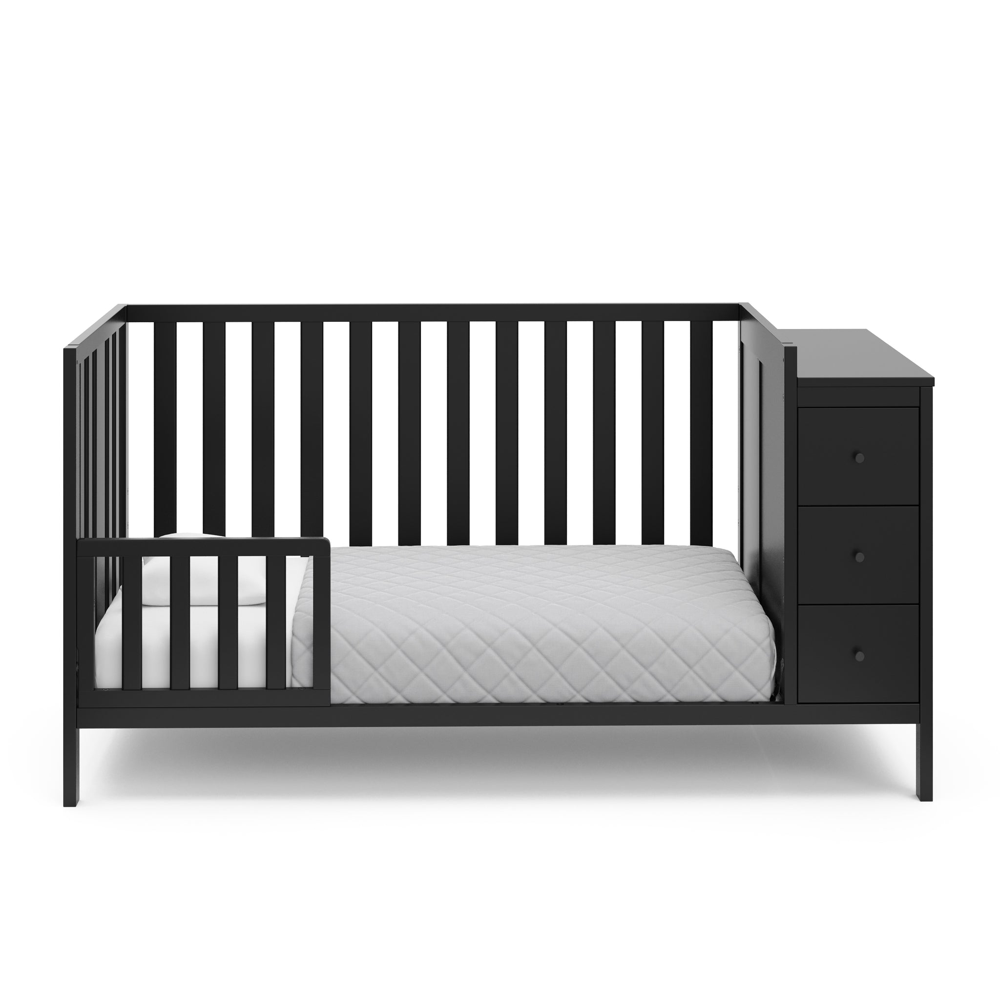 black crib with storage in toddler bed conversion with one safety guardrail