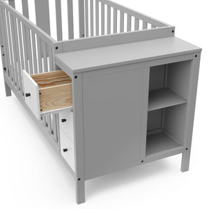 pebble gray and white crib with storage and open drawer