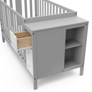 pebble gray and white crib with storage and open drawer