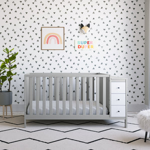 pebble gray with white crib and changer in nursery