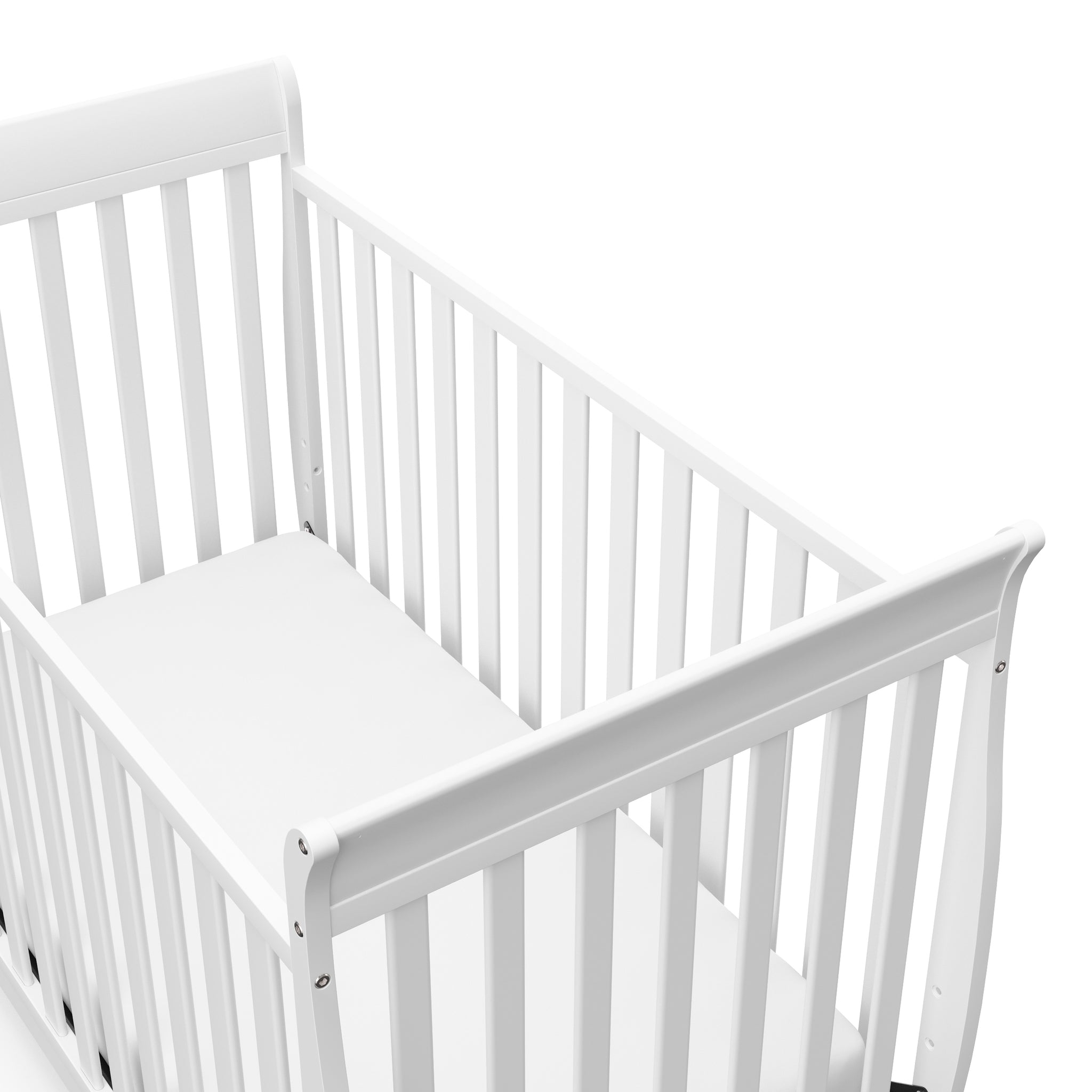 Close-up view of white crib's headboard