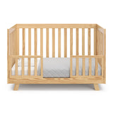 natural crib in toddler bed with two toddler safety guardrails
