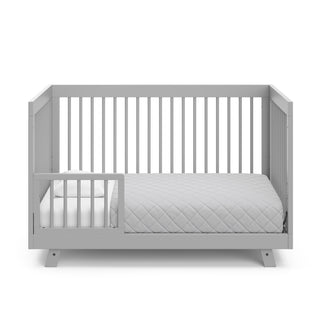 pebble gray in toddler bed conversion with one safety guardrail