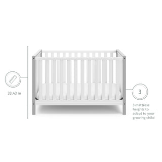 White crib with pebble gray with features graphic