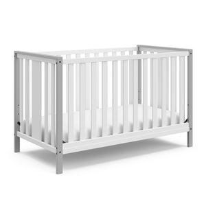 white crib with pebble gray angled